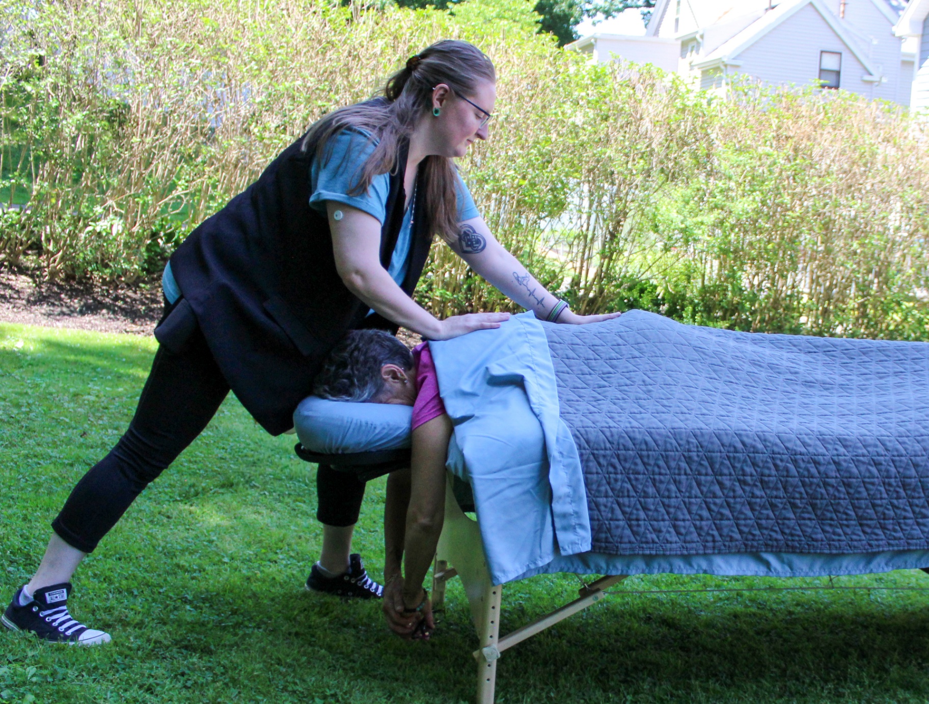 Outdoor chair massage session in a serene setting